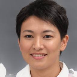 Joyful asian young-adult female with short  brown hair and brown eyes