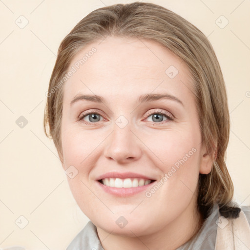 Joyful white young-adult female with medium  brown hair and blue eyes