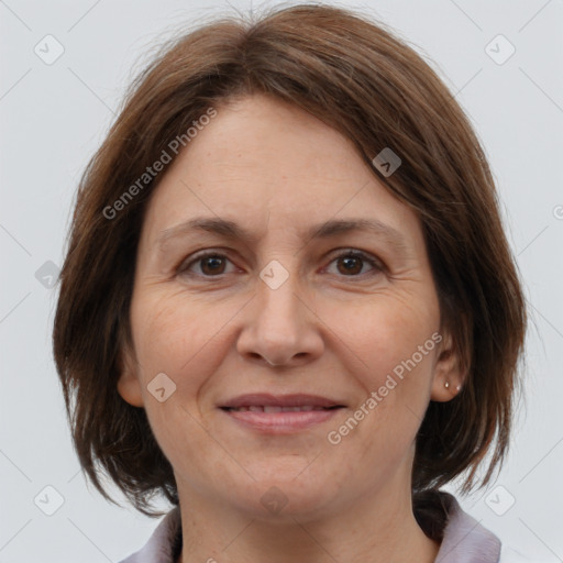 Joyful white adult female with medium  brown hair and brown eyes