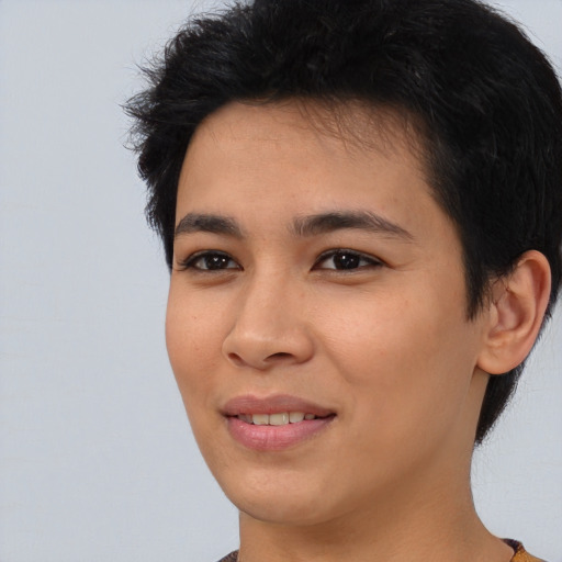 Joyful asian young-adult female with short  black hair and brown eyes