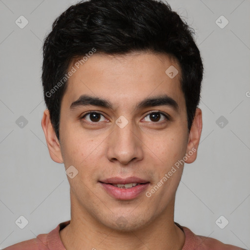 Joyful latino young-adult male with short  brown hair and brown eyes