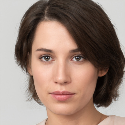 Neutral white young-adult female with medium  brown hair and brown eyes