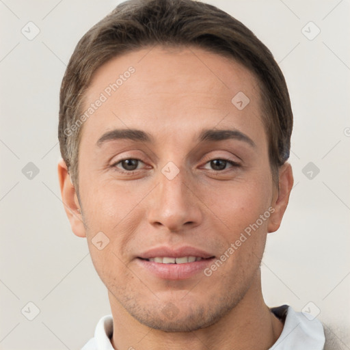 Joyful white young-adult male with short  brown hair and brown eyes