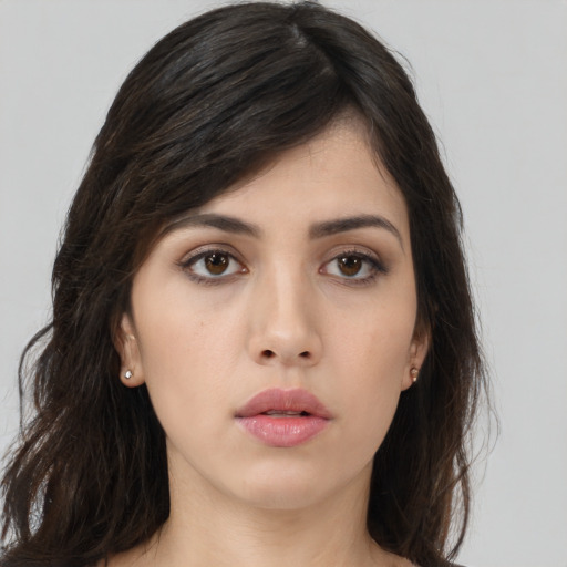 Neutral white young-adult female with long  brown hair and brown eyes