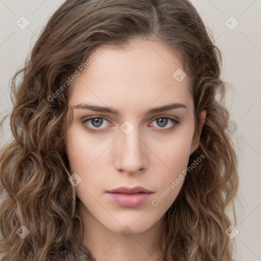 Neutral white young-adult female with long  brown hair and brown eyes