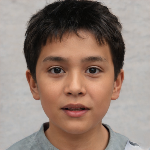 Joyful white child male with short  brown hair and brown eyes