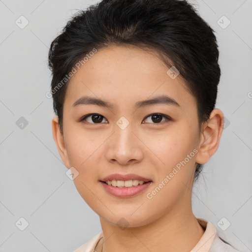 Joyful asian young-adult female with short  brown hair and brown eyes