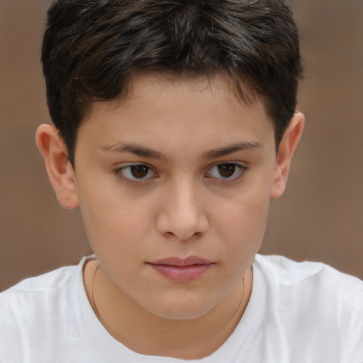 Joyful white child male with short  brown hair and brown eyes