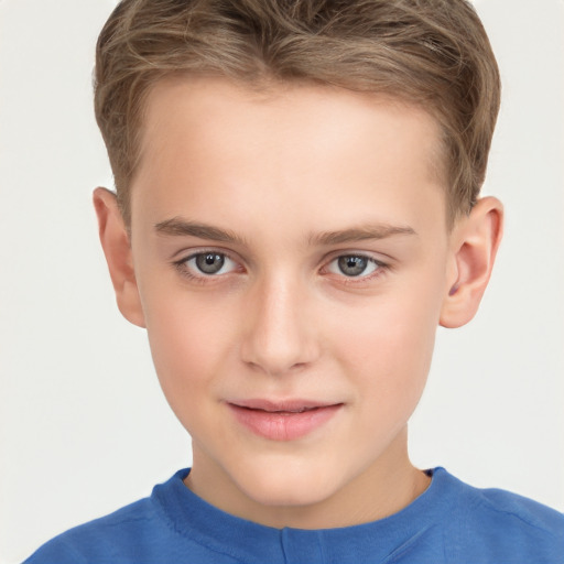 Joyful white child male with short  brown hair and grey eyes