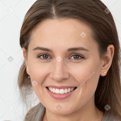 Joyful white young-adult female with long  brown hair and grey eyes