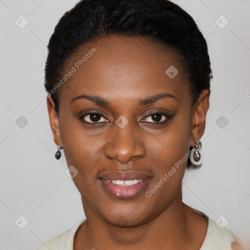 Joyful black young-adult female with short  black hair and brown eyes