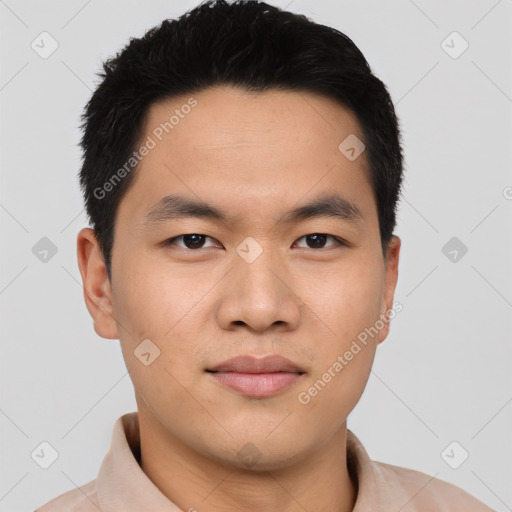 Joyful asian young-adult male with short  black hair and brown eyes