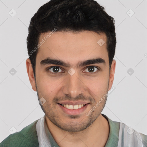 Joyful white young-adult male with short  brown hair and brown eyes