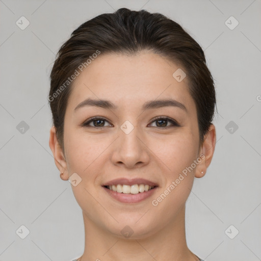 Joyful white young-adult female with short  brown hair and brown eyes