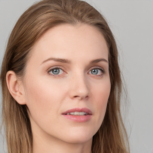 Joyful white young-adult female with long  brown hair and grey eyes