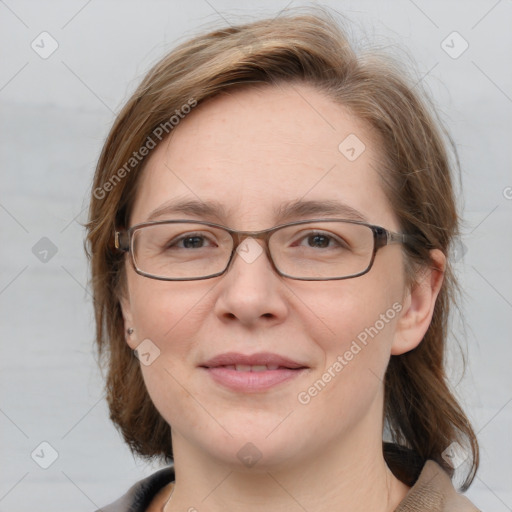 Joyful white adult female with medium  brown hair and grey eyes