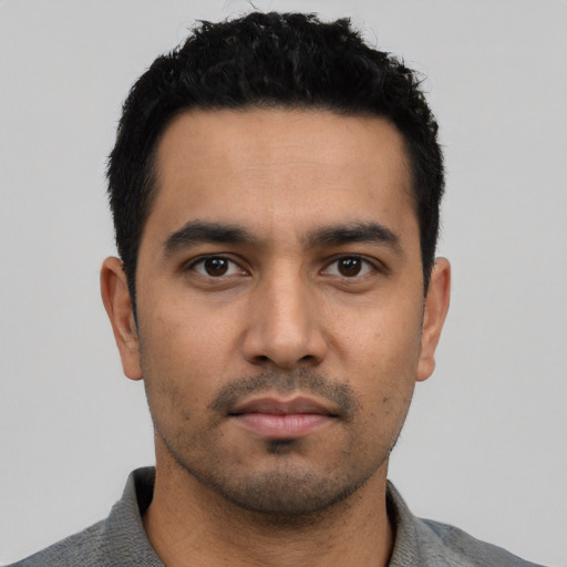 Neutral latino young-adult male with short  black hair and brown eyes