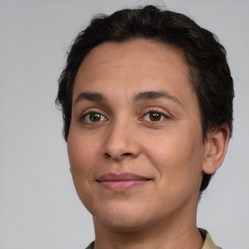 Joyful white adult female with short  brown hair and brown eyes