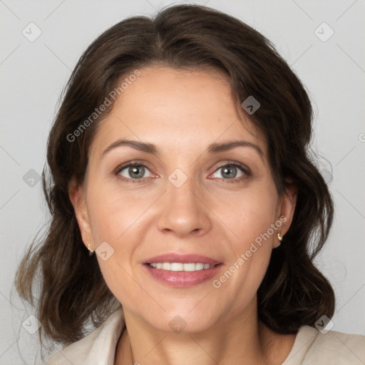 Joyful white adult female with medium  brown hair and grey eyes