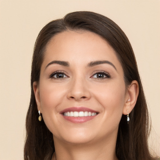 Joyful white young-adult female with long  brown hair and brown eyes