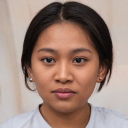 Neutral asian young-adult female with medium  brown hair and brown eyes