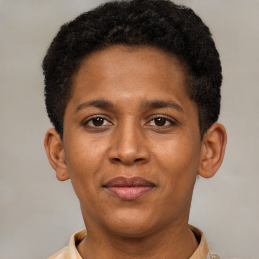Joyful black young-adult male with short  brown hair and brown eyes