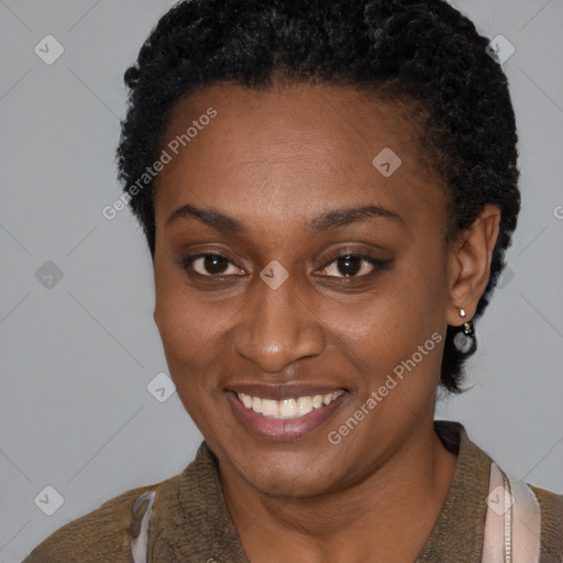 Joyful black young-adult female with short  brown hair and brown eyes