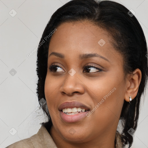 Joyful black young-adult female with medium  black hair and brown eyes