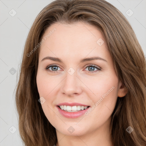 Joyful white young-adult female with long  brown hair and green eyes