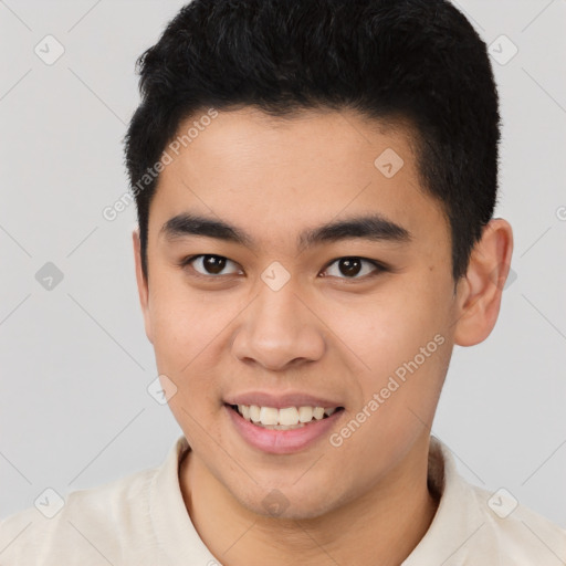 Joyful latino young-adult male with short  black hair and brown eyes