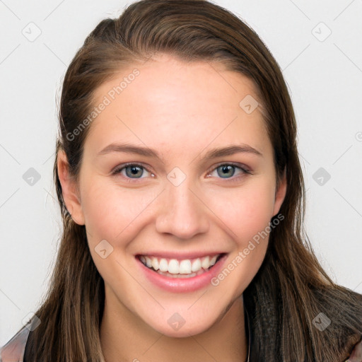 Joyful white young-adult female with long  brown hair and blue eyes