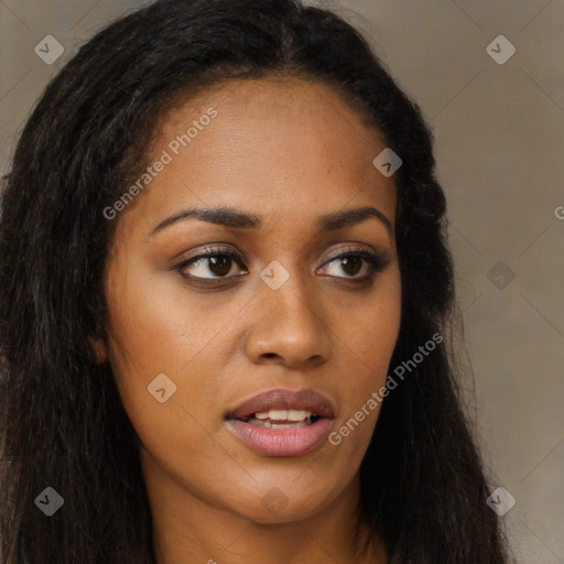 Joyful black young-adult female with long  brown hair and brown eyes