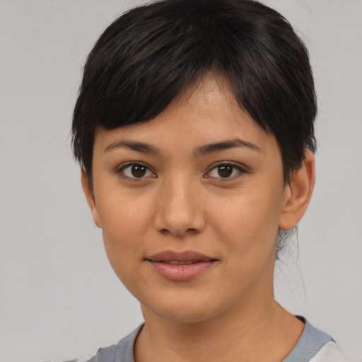Joyful asian young-adult female with short  black hair and brown eyes