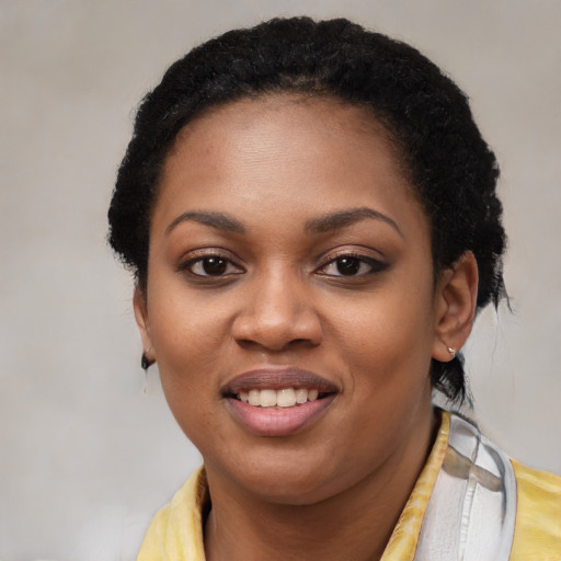 Joyful latino young-adult female with short  black hair and brown eyes