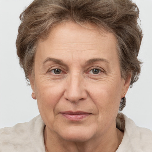 Joyful white middle-aged female with short  brown hair and grey eyes