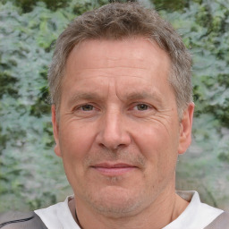 Joyful white middle-aged male with short  brown hair and brown eyes