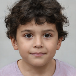 Joyful white child male with short  brown hair and brown eyes