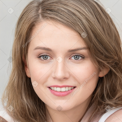 Joyful white young-adult female with long  brown hair and blue eyes