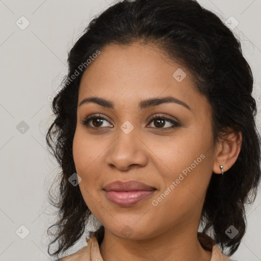 Joyful latino young-adult female with medium  brown hair and brown eyes