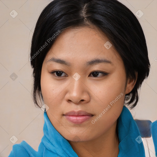 Joyful asian young-adult female with medium  black hair and brown eyes