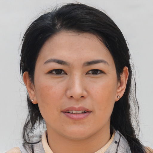 Joyful asian young-adult female with medium  black hair and brown eyes