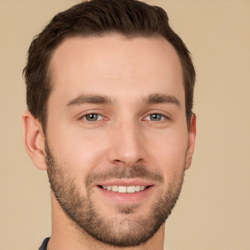 Joyful white young-adult male with short  brown hair and brown eyes