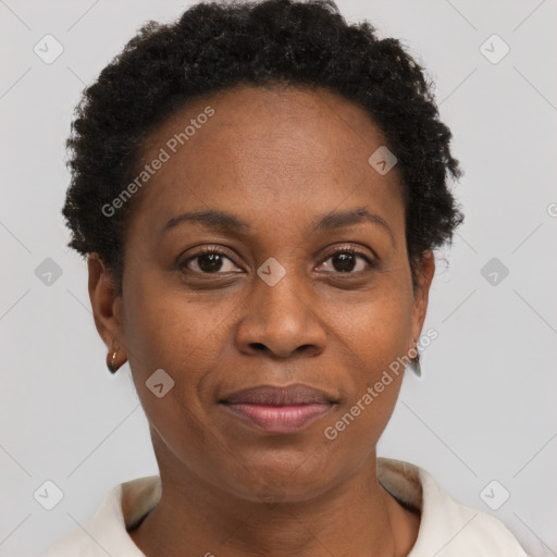 Joyful black adult female with short  brown hair and brown eyes