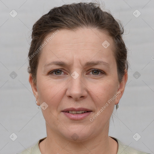 Joyful white adult female with short  brown hair and grey eyes