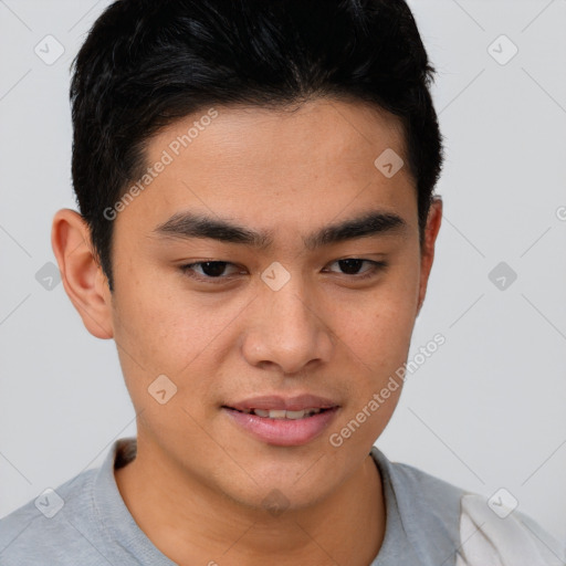 Joyful asian young-adult male with short  brown hair and brown eyes