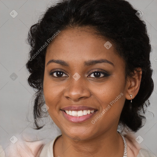 Joyful black young-adult female with long  brown hair and brown eyes