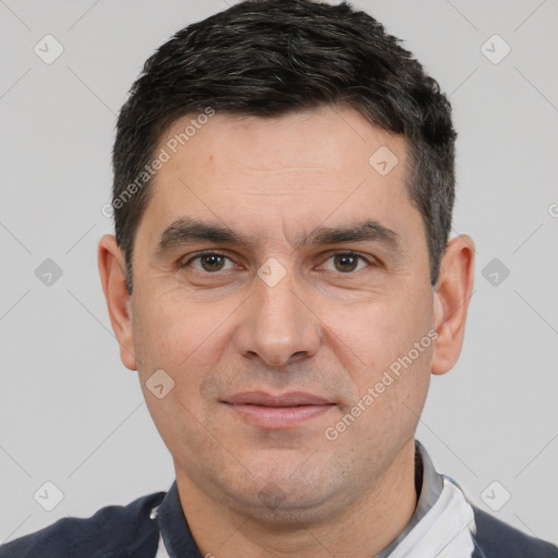 Joyful white adult male with short  brown hair and brown eyes