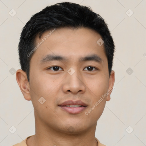 Joyful asian young-adult male with short  black hair and brown eyes