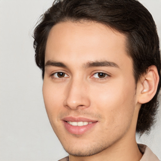 Joyful white young-adult male with medium  brown hair and brown eyes