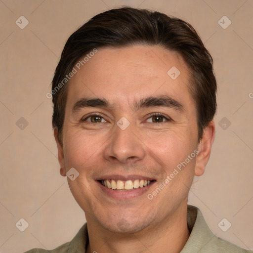 Joyful white adult male with short  brown hair and brown eyes